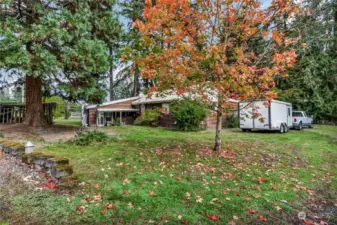Distant view of back side of home & yard