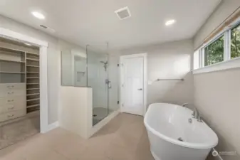 Indulge in the elegance of this master bathroom, featuring a stunning glass-surround shower that offers a sleek, modern look and a spa-like experience.