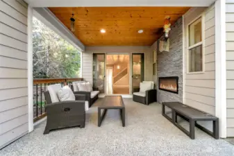 Just off the dining area this covered patio with double-sided gas fireplace not only adds warmth and elegance to the family room/covered outdoor area but also creates a stunning visual connection between all adjoining areas.