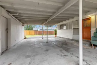 Large attached carport with workshop.