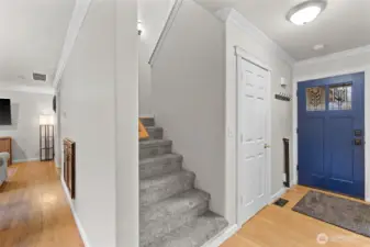 Hall to upstairs, entry, right is living, left towards kitchen, dining behind.