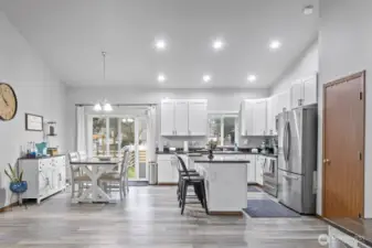 View from the living room into the dining and kitchen area
