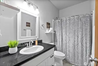 Bathroom divides Bedroom 1 and 2