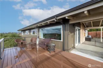 Easy deck access from living room via covered patio.