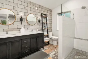 Remodeled Primary Bath featuring double vanity and large walk-in shower.