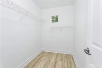 Primary walk in closet, plenty of room for everything