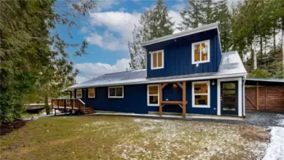 Great backyard with a spot to shuck your fresh oysters, or sit and enjoy the creek flowing along the property