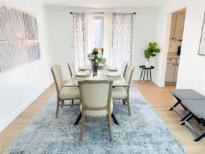 Dining room conveniently connects with kitchen on the right and an upper area deck through the sliding door.