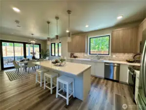 Open kitchen & dining with direct access to outdoor patio