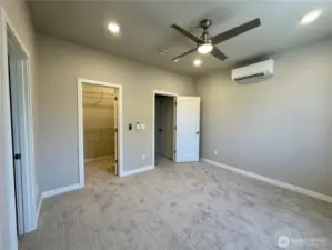 Upstairs primary with walk-in closet and en suite