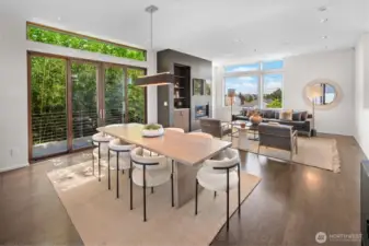 Dining and open kitchen, featuring fir clad Marvin sliding doors to the side patio leading to the front and back yard spaces