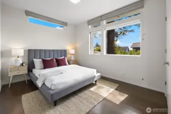 Second upstairs bedroom featuring south facing windows and even a peek-a-boo view