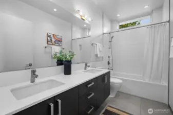 Secondary upstairs bathroom, built 6" wider than standard with a 66" long soaking tub and dual sink vanity