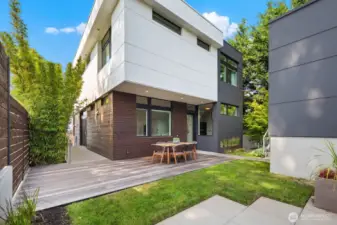 Back yard space, with large entertaining deck built at the same level as the lower yard. Gas stubbed for a BBQ. Detached two-car garage located off to the north side of the lot