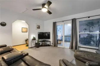 Coming up the stairs is the loft area with windows and new deck.  Attic entrance has stairs and is finished.