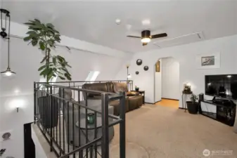 View from the top of the stairs. Doorway takes you into the additional bonus room which is currently the primary bedroom, there is a full bath and walki-n closet.