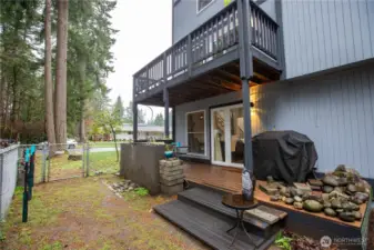Upstairs deck just off of loft, deck from dining area with fenced side yard and waterfall feature.