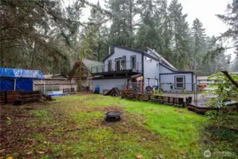 Fenced in back yard with chicken coop