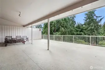 Huge entertaining deck that overlooks the large back yard.