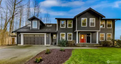 Freshly painted exterior (2025) sets the tone for this well-maintained Northwest Contemporary home, offering a crisp, updated look against a peaceful country backdrop. Attached garage and ample parking support everyday functionality and rural living.