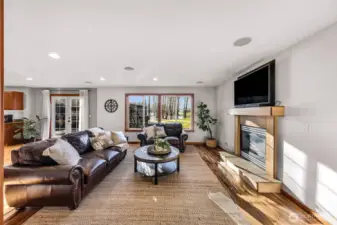 Living room offers a welcoming atmosphere with generous natural light and room for multiple furniture arrangements. The layout supports both conversation and relaxation.