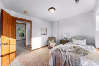 Another bedroom view highlights natural light and comfortable scale. A flexible space suitable for various needs.