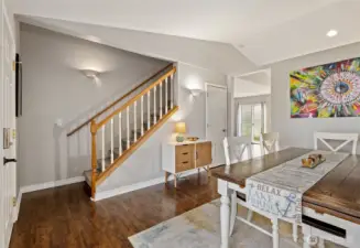 Stairs and hallway to kitchen and second living room