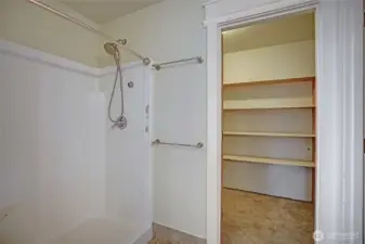 Upstairs primary ensuite shower and closet.