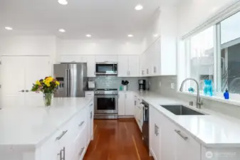 View of kitchen standing in dining room.