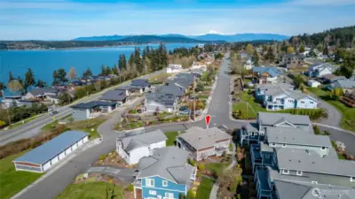 Aerial photo of the property undoubetly showcases the 180-degree views from Mt Baker in the northeast, across Guemes Island and Guemes Channel, waterways and out towards the San Jan Islands.