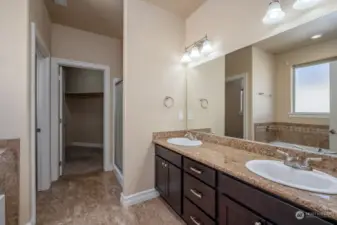 Two sinks add to the conveniences that make this home a favorite. The close is in the distance.