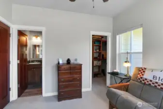 main floor guest room with bathroom and walk in closet shown