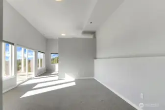 Current downstairs family/media room with 16' ceilings