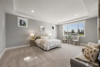 The capacious and luxurious primary suite is located on main level, and includes its own private ensuite and large walk-in wardrobe.
