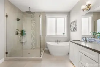 Soak your cares away, or take a lingering shower in the stunning glass enclosed tile shower.