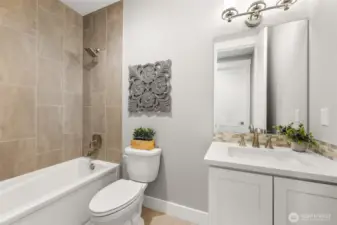 A beautifully appointed main hall bath.