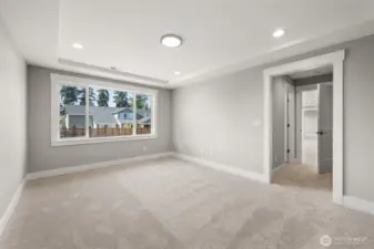 Grand lower level guest/secondary suite includes a closet and direct access to the full bath.