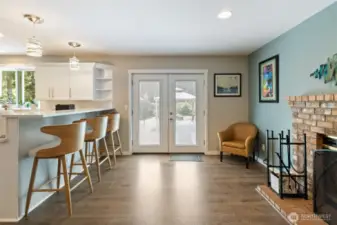 French doors lead to your backyard oasis.