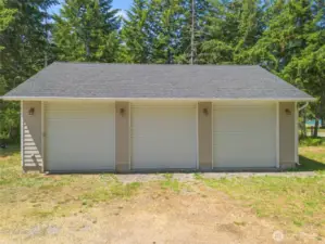 3 bay shop - man door on the side. vaulted ceilings.