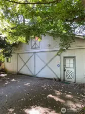 "Front" side of house with four car garage.