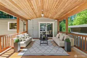 Step outside off of the dining room to an expansive covered deck that has been freshly stained and is BBQ setup ready