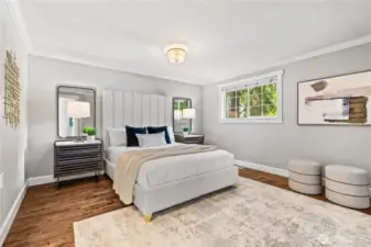 The primary suite features an ensuite bath, walk in closet, and french doors to a den/bonus room