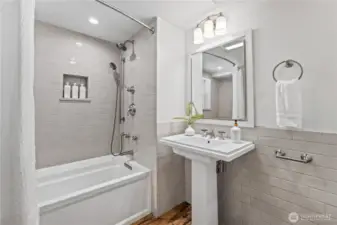 The lower level also features a second full bathroom complete with a bathtub for relaxing