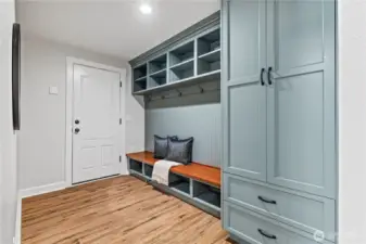 This smart mudroom entry with built-in storage and coat hooks will help keep everyday essentials organized as you come in from the garage