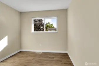 2nd upstairs bedroom  with vinyl plank flooring.