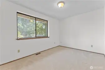 Main level bedroom 2 with new carpet & paint