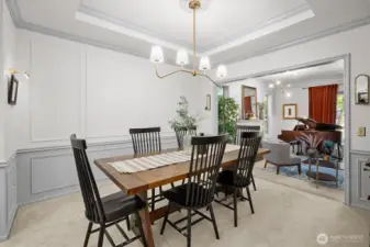 Dining room with detailed millwork and crown accents