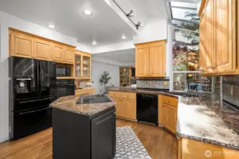 Spacious kitchen overlooking family living area and yard