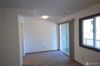 Dining area with slider leading to covered patio