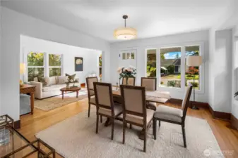 Looking back at the front door with dining and living rooms